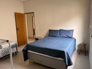 En eller flere senge i et værelse på Beachfront house in Lagoinha