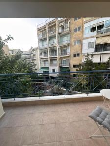an apartment balcony with a view of a building at Bloem in Komotini