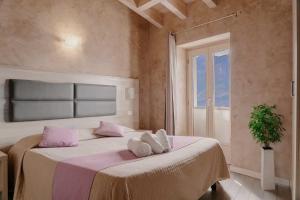 Postel nebo postele na pokoji v ubytování Hotel Miralago
