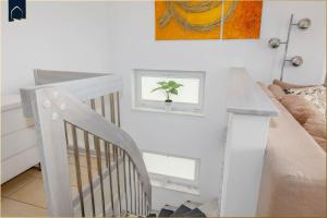 Ένα ή περισσότερα κρεβάτια σε δωμάτιο στο Ferienwohnung Krebssee Idyll 2