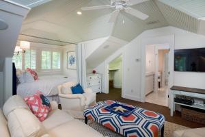 a living room with a couch and a bed at 4 Bedroom Wilson Village Home 43 in Bluffton