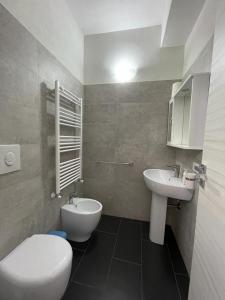 a bathroom with a toilet and a bidet and a sink at La casa dei tre platani in Case Torre di Sacco +57 photos