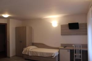 Postel nebo postele na pokoji v ubytování Hotel Miralago