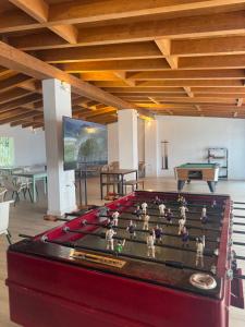 a ping pong table with dolls on top of it at Camping Turismar in Tossa de Mar +105 photos
