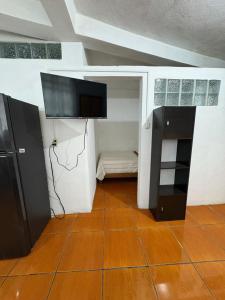 TV a/nebo společenská místnost v ubytování Loft apartment en Av Cri Cri