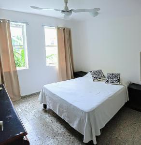 Postel nebo postele na pokoji v ubytování Casa Blanca Cancun