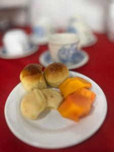 a plate of food on a red table at Hotel e Restaurante Casa Velha in Barra Longa