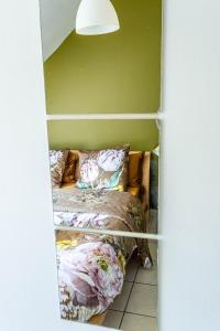 a closet with two beds in a room at Apartment Douillet in Saint-James