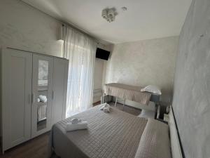 Postel nebo postele na pokoji v ubytování Hotel Eriale Nuova Gestione