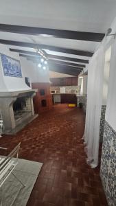 a large room with a fireplace and a white curtain at PALAZZO Sintra GH in Sintra