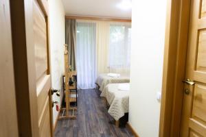 Postel nebo postele na pokoji v ubytování Lastili Inn Hotel