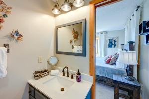 a bathroom with a sink and a bedroom with a bed at Yellow Mountain Vista Echoes at 4400 in Cullowhee +27 photos