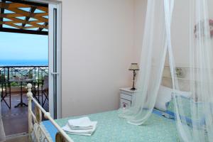 Posteľ alebo postele v izbe v ubytovaní Orizzonte Apartments Lefkada