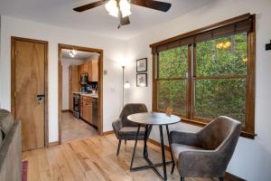 a living room with a table and two chairs at Elk Ridge Retreat -Hot Tub- Firepit-Fireplace in Maggie Valley