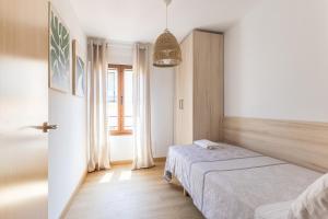 Ένα ή περισσότερα κρεβάτια σε δωμάτιο στο BaruHaus Murias +3 φωτογραφίες