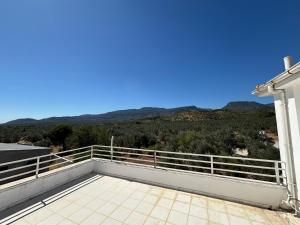 a balcony with a view of the mountains at Grand Alver Otel in Edremit
