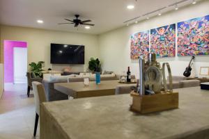 a living room with couches and a flat screen tv at Casa Sta Inés in Cuautla Morelos