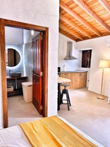 a room with a kitchen with a bed and a table at Casas Javier in Adeje +46 photos