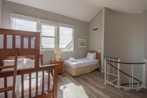 a bedroom with a bunk bed and a bed at 140 Capt John Fripp Villa in Fripp Island