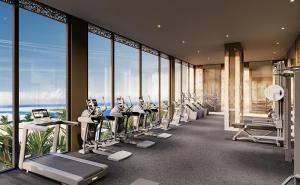 a gym with a row of treadmills and machines at Shah Palace Zanzibar - All Suites in Matemwe