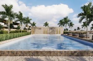 a swimming pool in a villa with palm trees at Shah Palace Zanzibar - All Suites in Matemwe