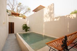 a swimming pool in the backyard of a house at Casa Oma 03 in Tepoztlán
