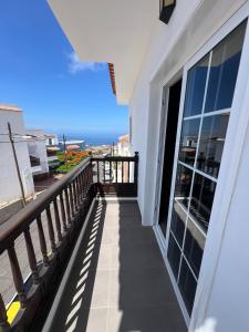 a balcony of a building with a view of the ocean at Apartamento Celma in Adeje