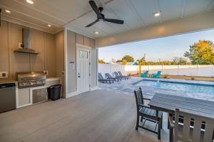 a kitchen and dining room with a table and a pool at Brand New Home with In-ground Pool, Four Houses From Beautiful Laguna Beach in Laguna Beach
