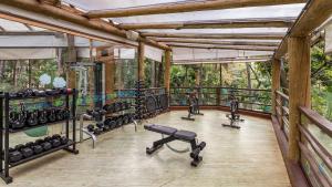 a gym with lots of exercise equipment in a room at Rio Quente Resorts - Hotel Giardino in Rio Quente