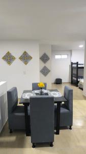 a dining room with a table and some chairs at Circacia city in Circasia