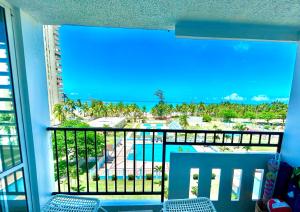 Rõdu või terrass majutusasutuses Luquillo Beach & Ocean Breeze