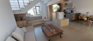 an overhead view of a living room and kitchen with a table at Casa di Laino in Kounoupidhianá