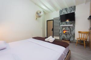 Postel nebo postele na pokoji v ubytování Hotel Lares 70 Laureles