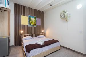 Postel nebo postele na pokoji v ubytování Hotel Lares 70 Laureles