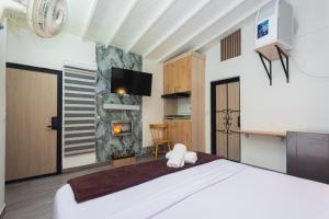 Postel nebo postele na pokoji v ubytování Hotel Lares 70 Laureles