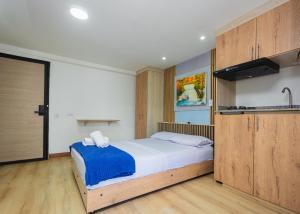 Postel nebo postele na pokoji v ubytování Hotel Lares 70 Laureles