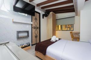 Postel nebo postele na pokoji v ubytování Hotel Lares 70 Laureles