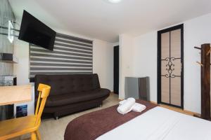 Postel nebo postele na pokoji v ubytování Hotel Lares 70 Laureles