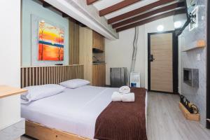 Postel nebo postele na pokoji v ubytování Hotel Lares 70 Laureles