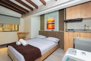Postel nebo postele na pokoji v ubytování Hotel Lares 70 Laureles