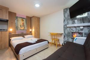 Postel nebo postele na pokoji v ubytování Hotel Lares 70 Laureles