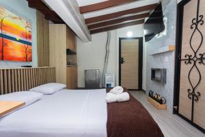 Postel nebo postele na pokoji v ubytování Hotel Lares 70 Laureles