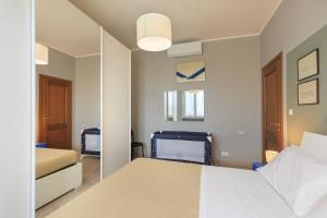 En eller flere senge i et værelse på Appartamento Dante