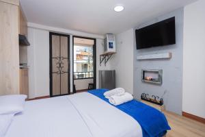 Postel nebo postele na pokoji v ubytování Hotel Lares 70 Laureles