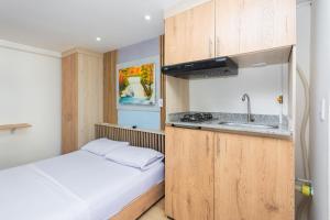 Kuchyň nebo kuchyňský kout v ubytování Hotel Lares 70 Laureles