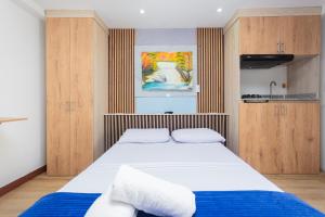 Postel nebo postele na pokoji v ubytování Hotel Lares 70 Laureles