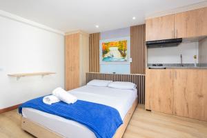 Postel nebo postele na pokoji v ubytování Hotel Lares 70 Laureles