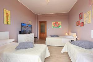 En eller flere senge i et værelse på Appartamento Dante