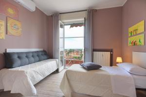 En eller flere senge i et værelse på Appartamento Dante