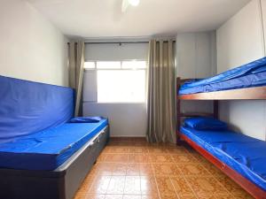 Postel nebo postele na pokoji v ubytování Apto Tupi a 50m do mar – ótima localização